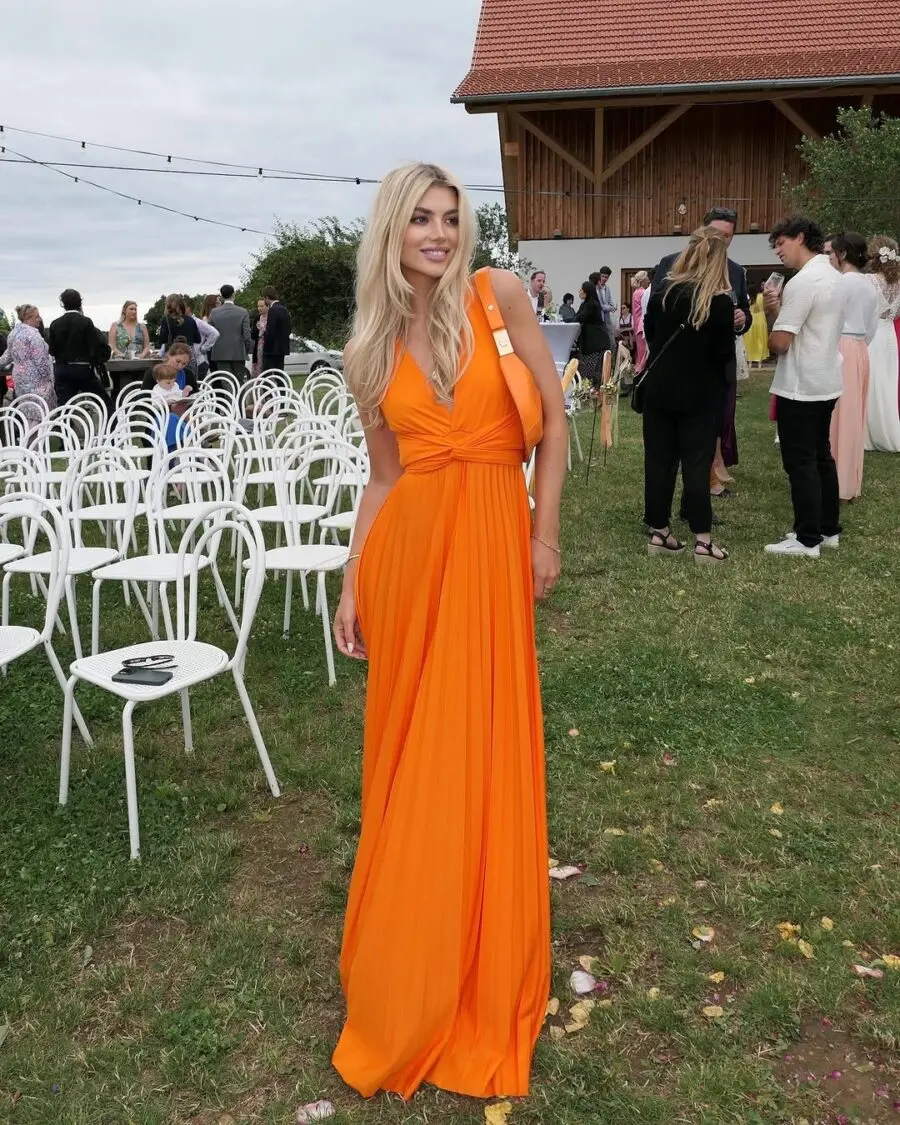Bright orange gown perfect for summer weddings