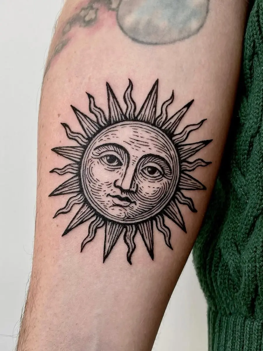 Intricate sun tattoo with classic vintage flair
