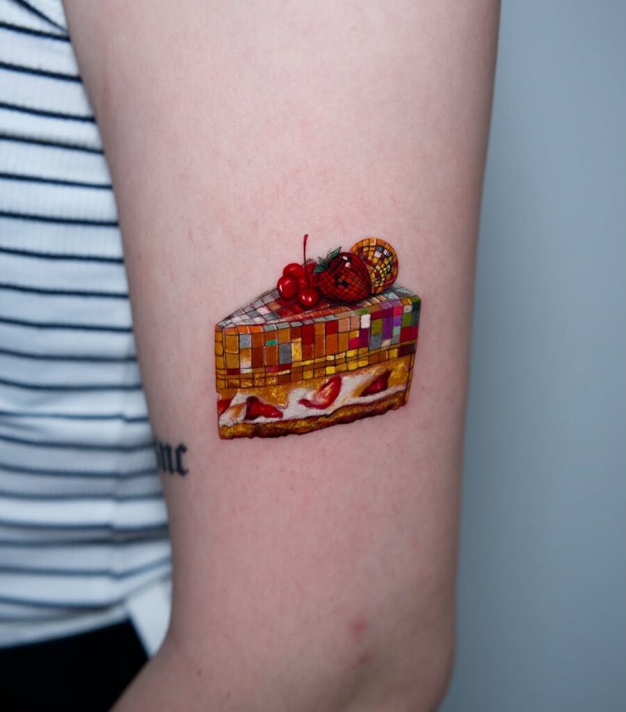 Colorful cake tattoo for playful vibes