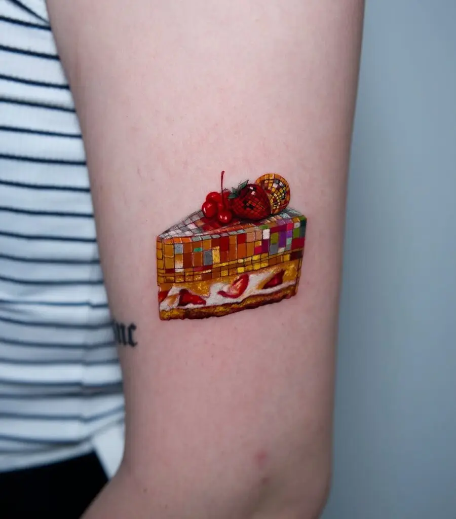 Colorful cake tattoo for playful vibes