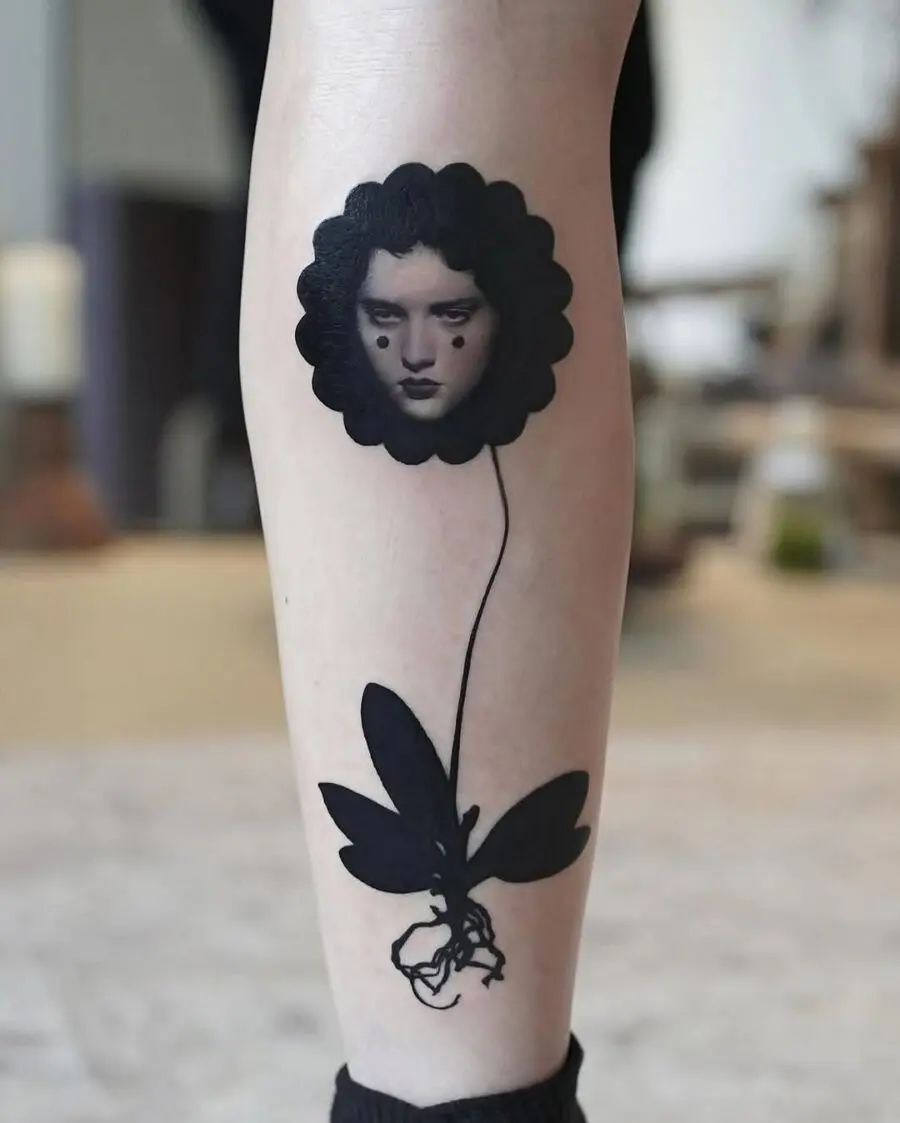 Unique black flower face tattoo inspiration