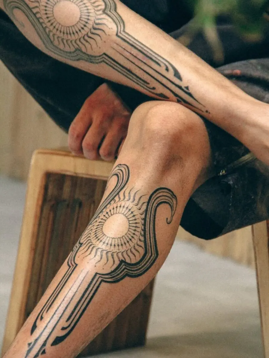Sun-Inspired Ancient Tattoo for Unique Style