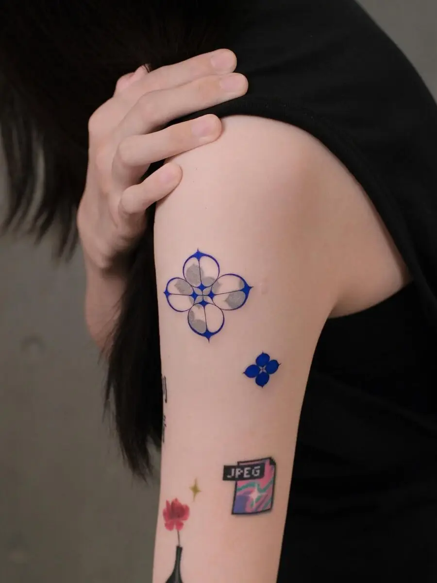 Delicate blue floral aesthetic tattoo designs