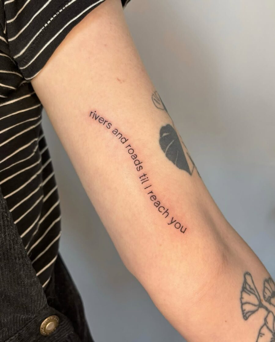 Minimalistic script tattoo with emotional message