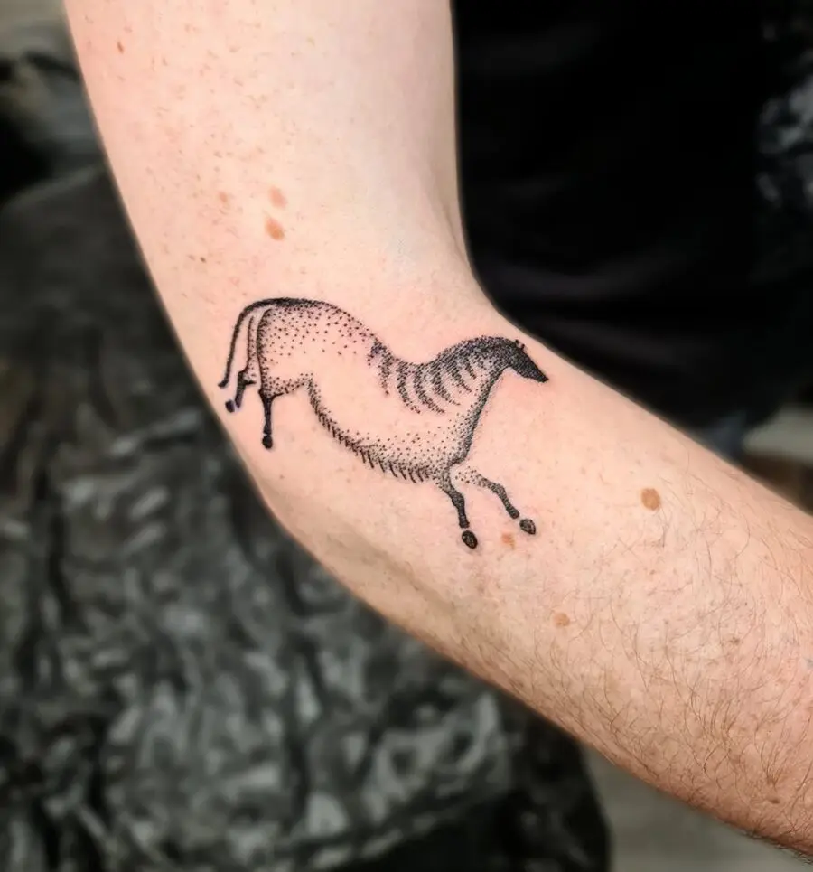 Stylized horse tattoo using dotted technique