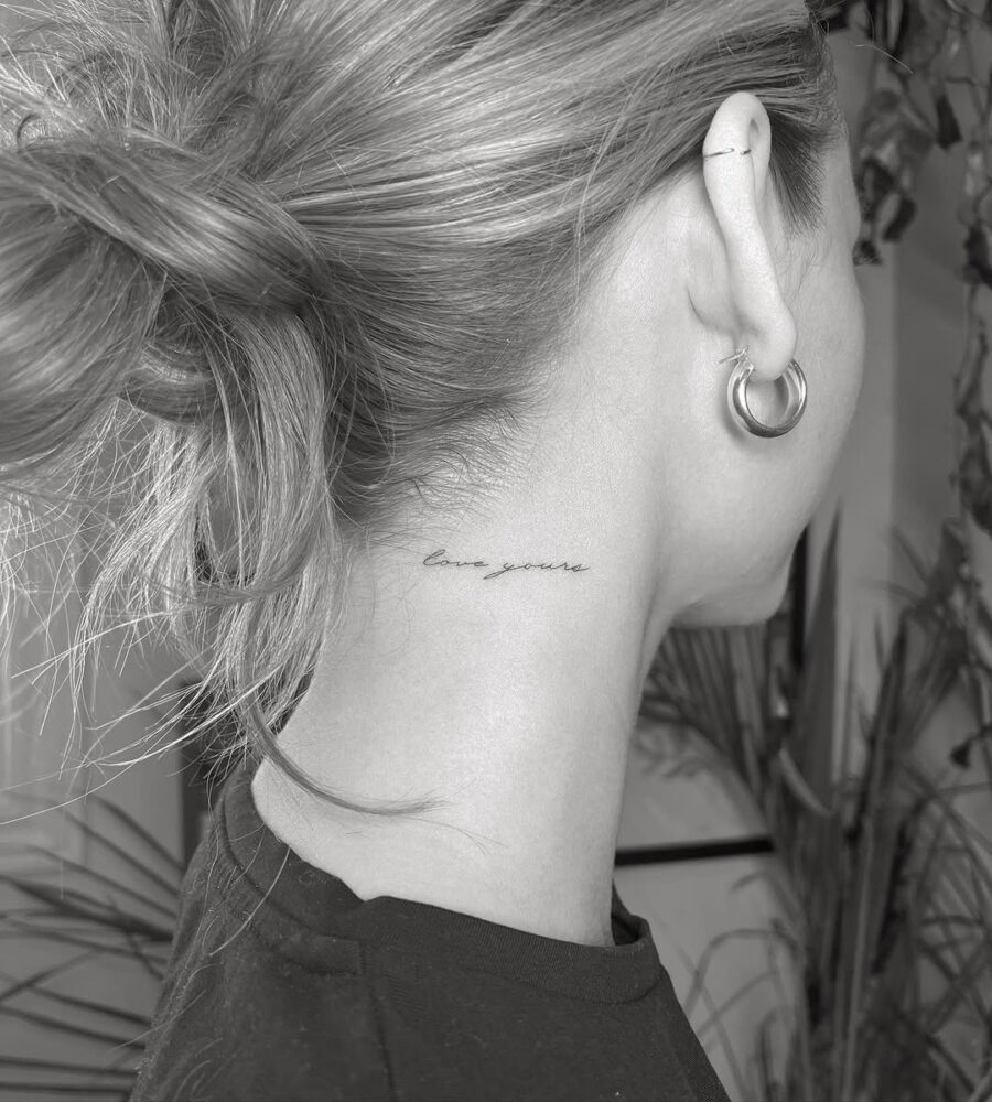 Elegant neck tattoo reading 'love yourself'
