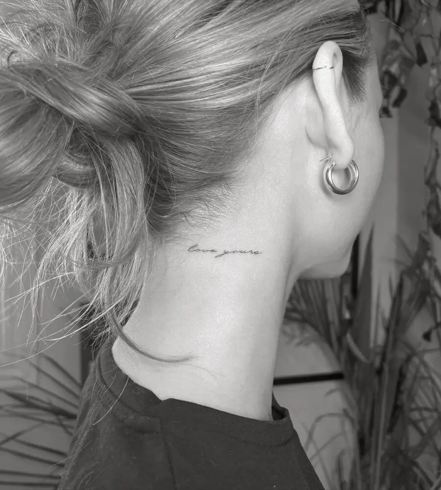 Elegant neck tattoo reading 'love yourself'