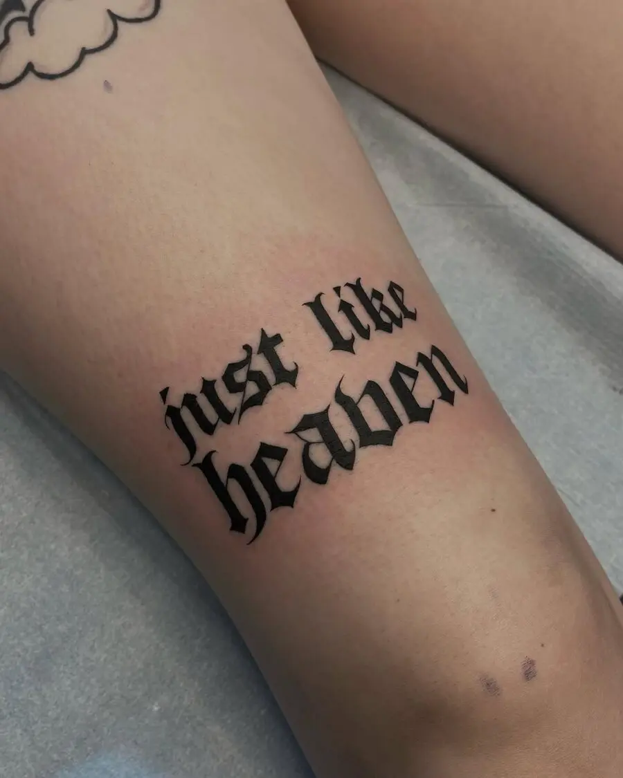 Sleek cursive tattoo pays tribute to bliss