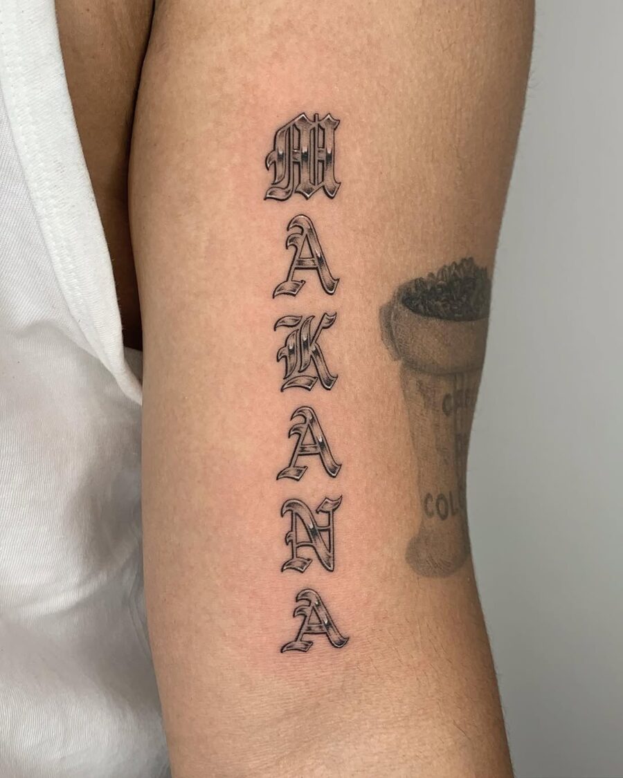 Stylish vertical tattoo featuring the word 'Makana'