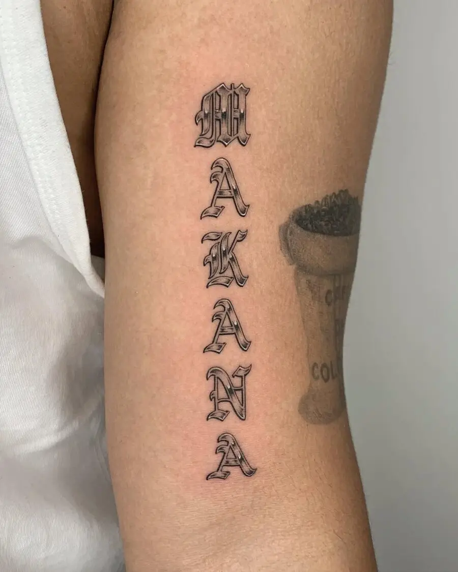 Stylish vertical tattoo featuring the word 'Makana'