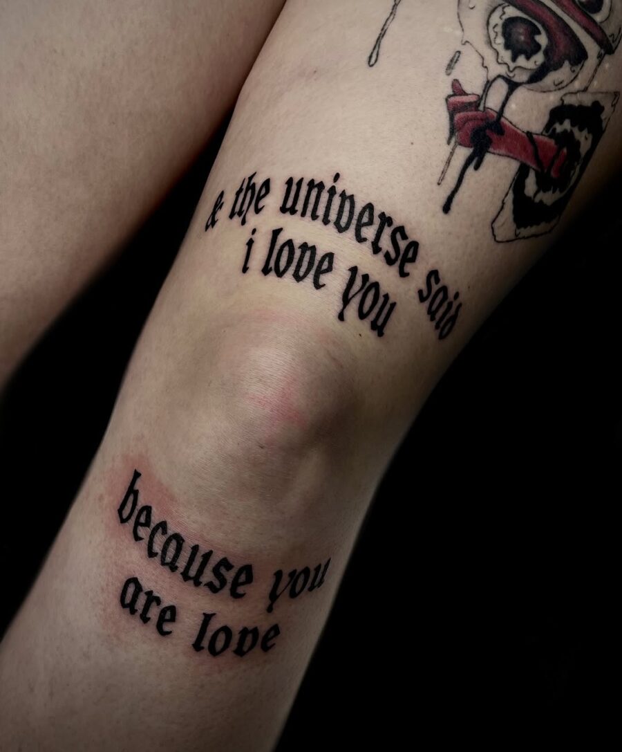Elegant script tattoo expressing love's essence