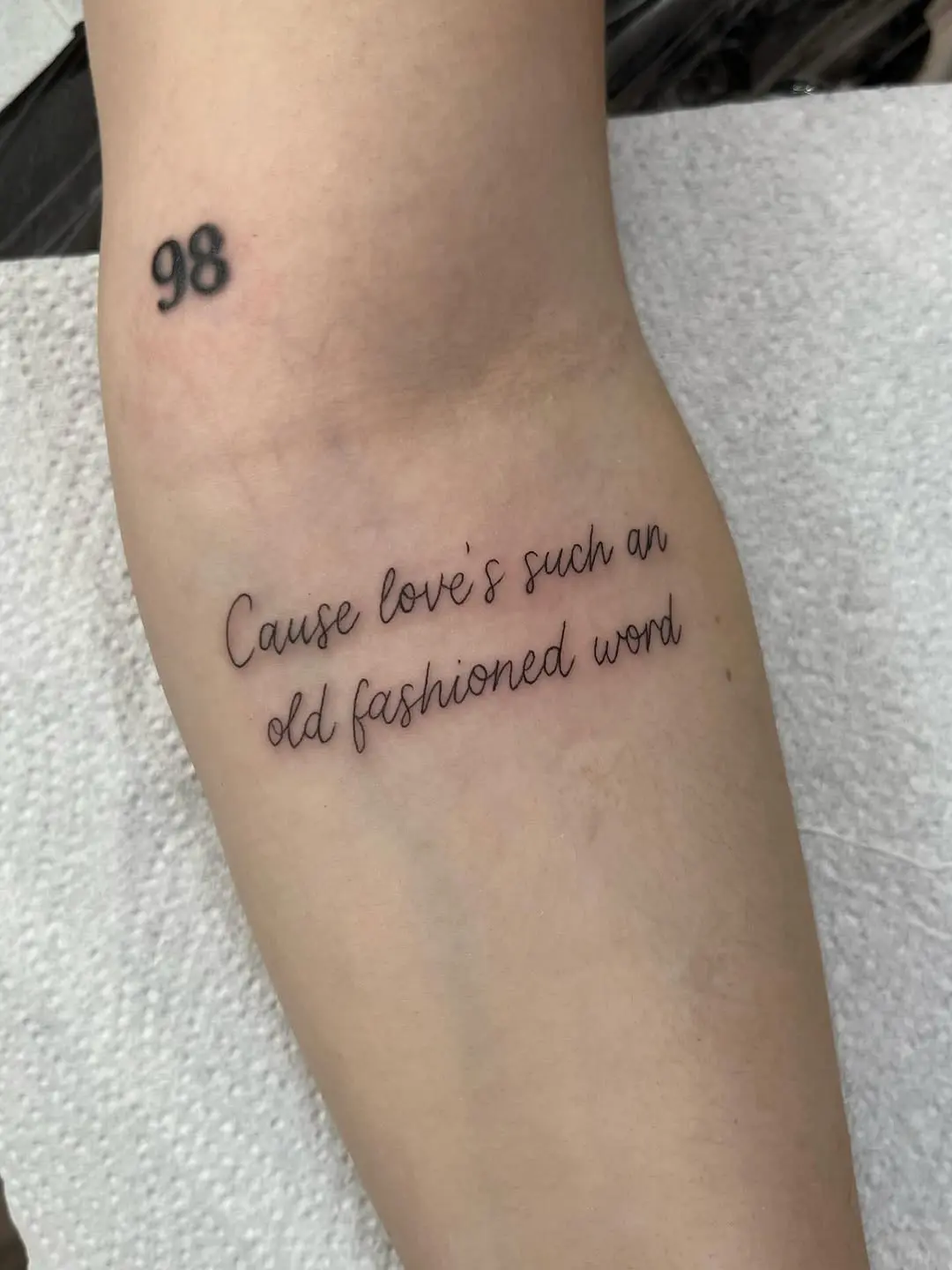 Elegant cursive tattoo with a heartfelt message