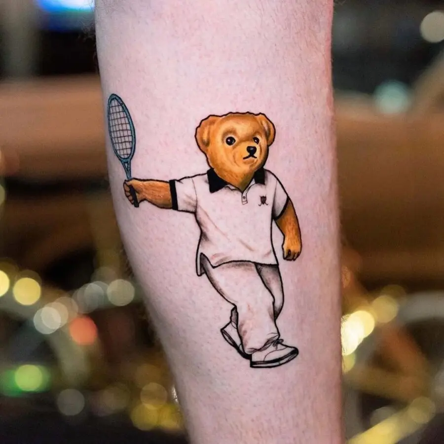 Adorable bear playing tennis tattoo design
