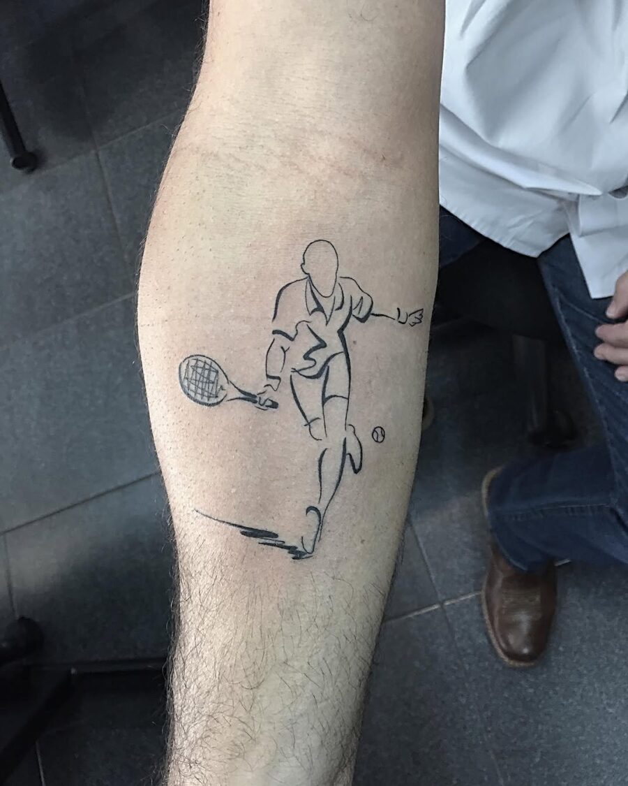 Stylish tennis player inked on forearm