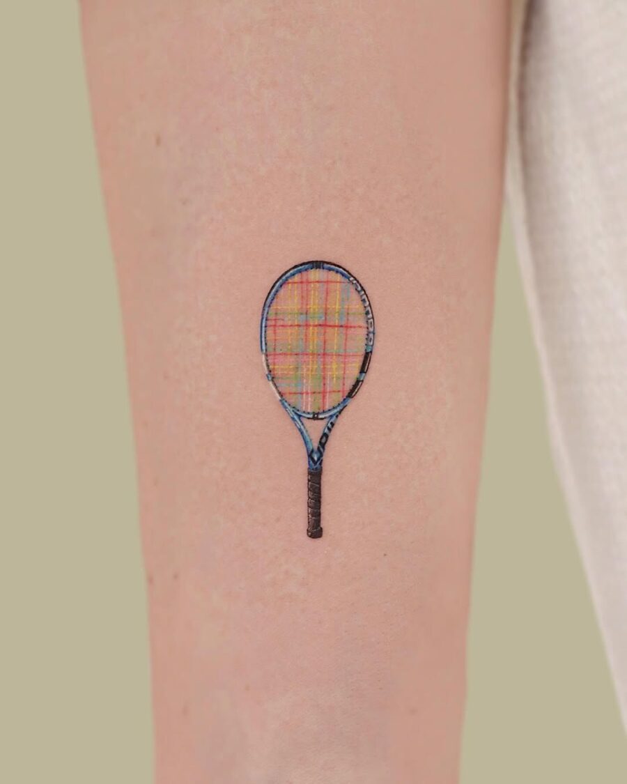 Creative tennis racket tattoo with plaid pattern