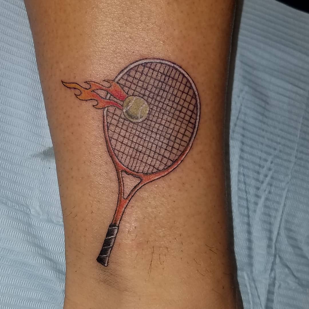 Artistic tennis racket tattoo with dynamic flames