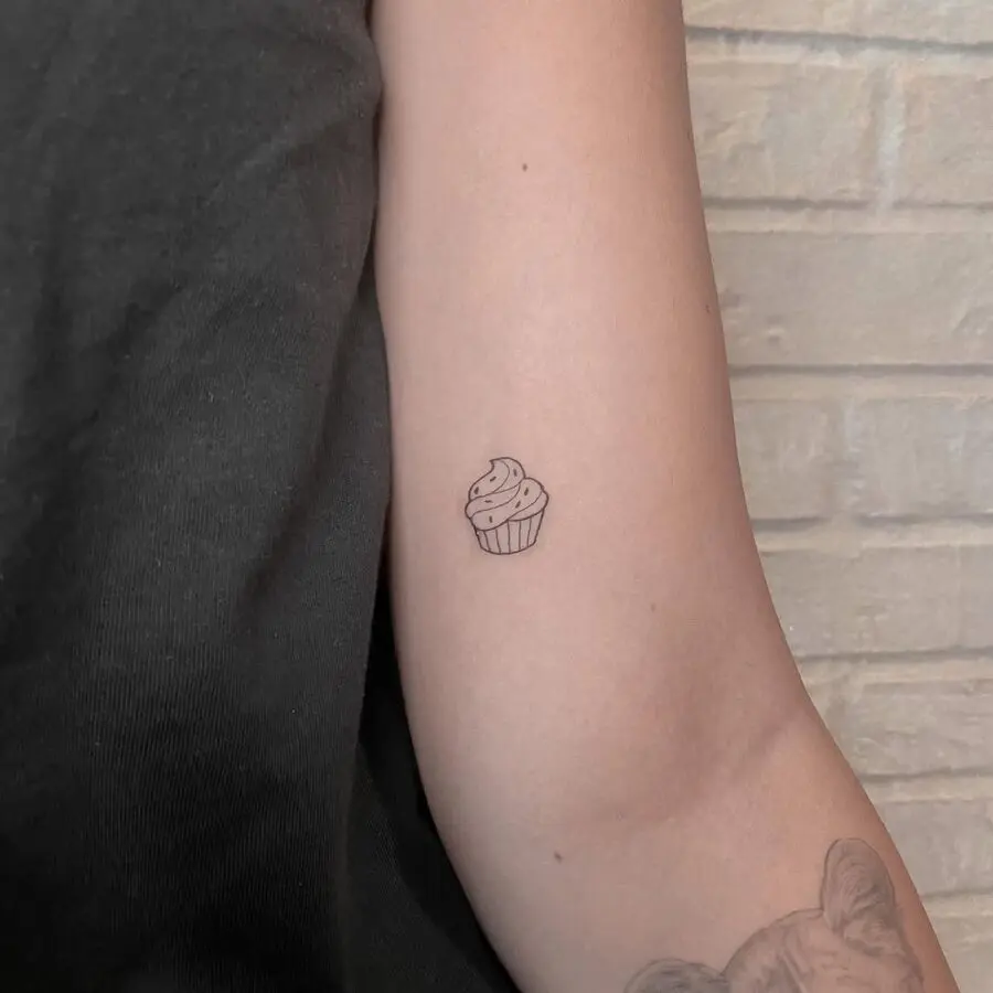 Charming tiny cupcake tattoo on the arm