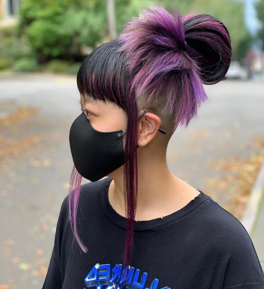 Edgy undercut with vibrant purple highlights