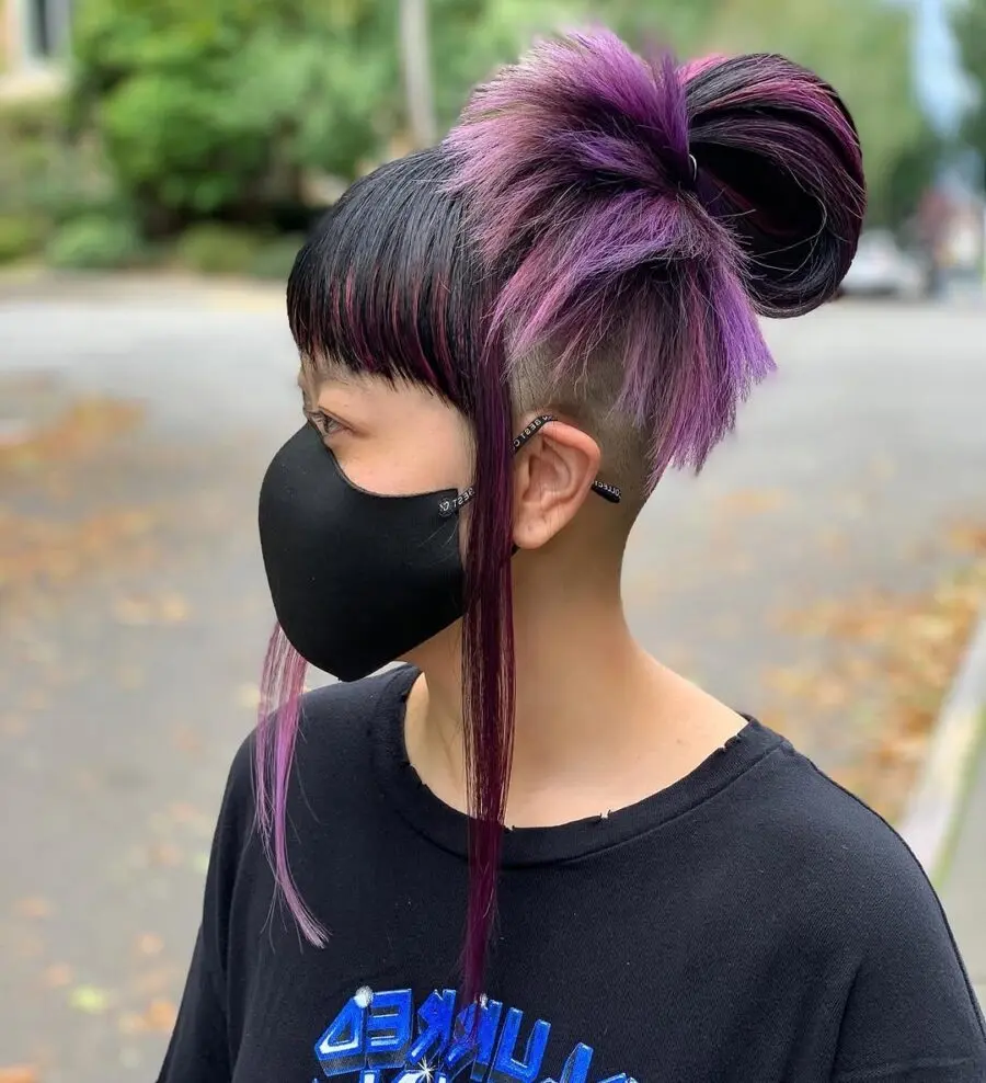 Edgy undercut with vibrant purple highlights
