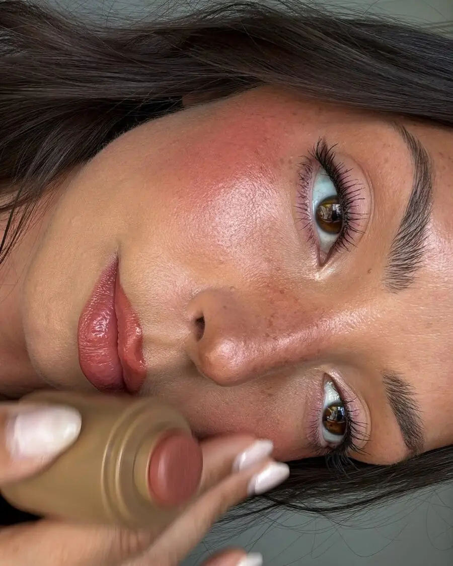 Sunkissed glow with brushed lips and cheeks