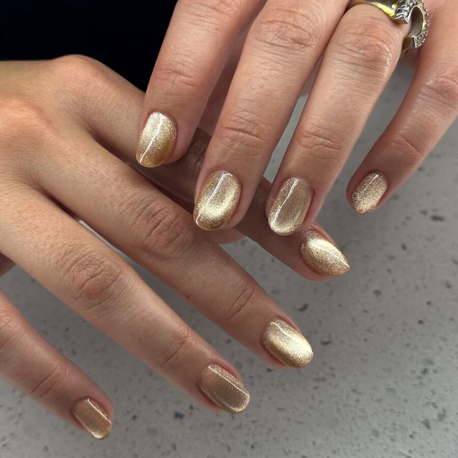 Elegant golden velvet nails with a shimmering finish