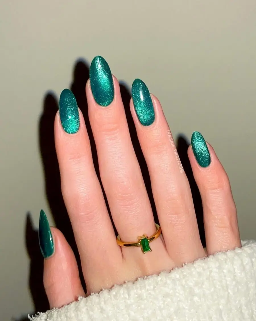 Vibrant turquoise velvet nails with sparkling finish