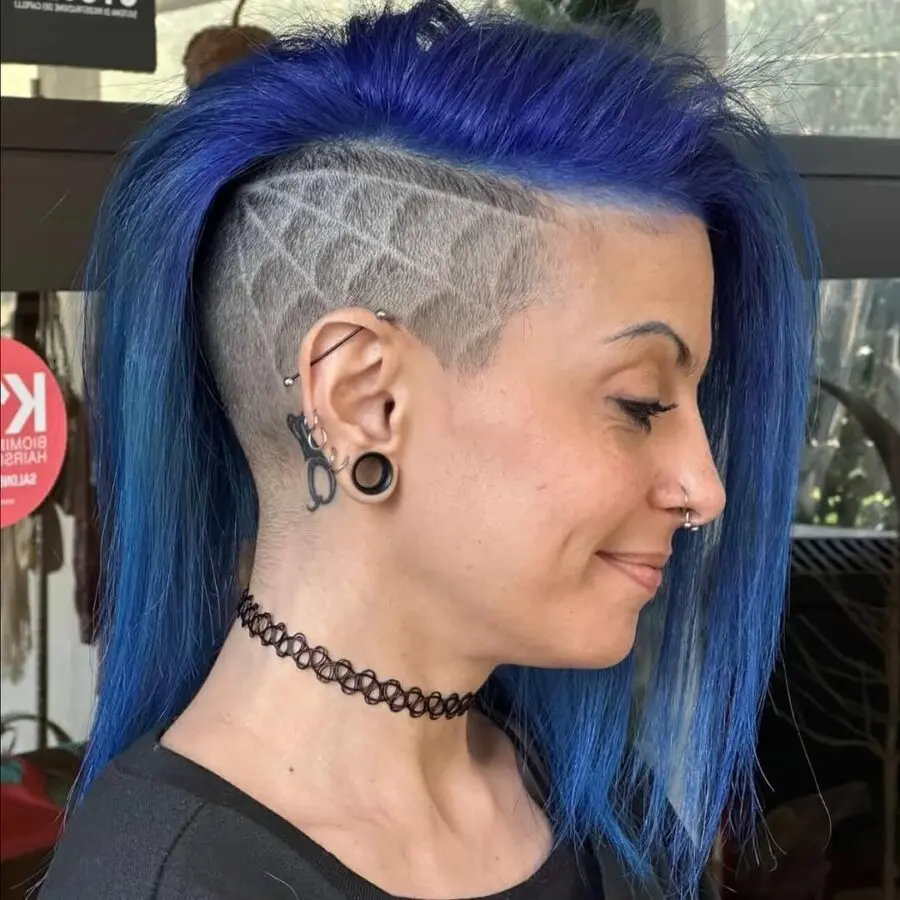 Bold blue undercut with unique shaved designs