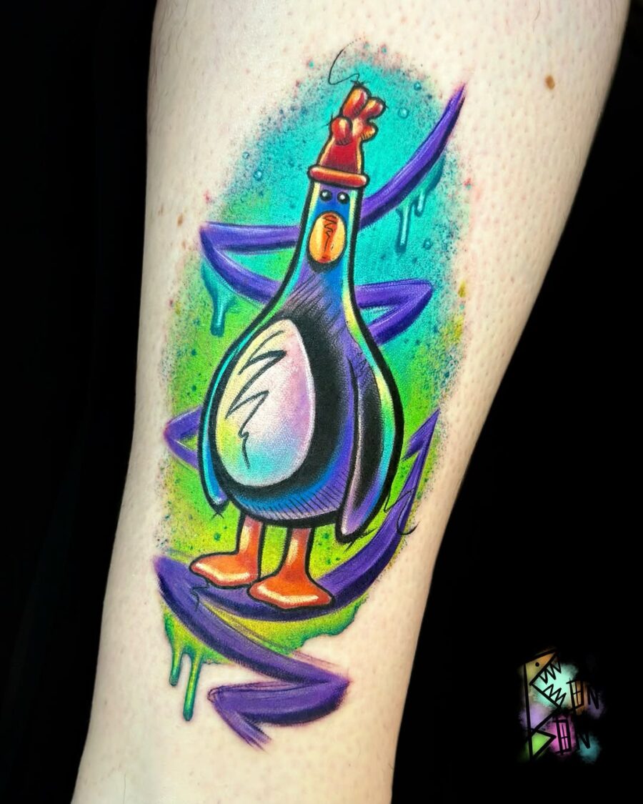 Whimsical pigeon tattoo bursting with color