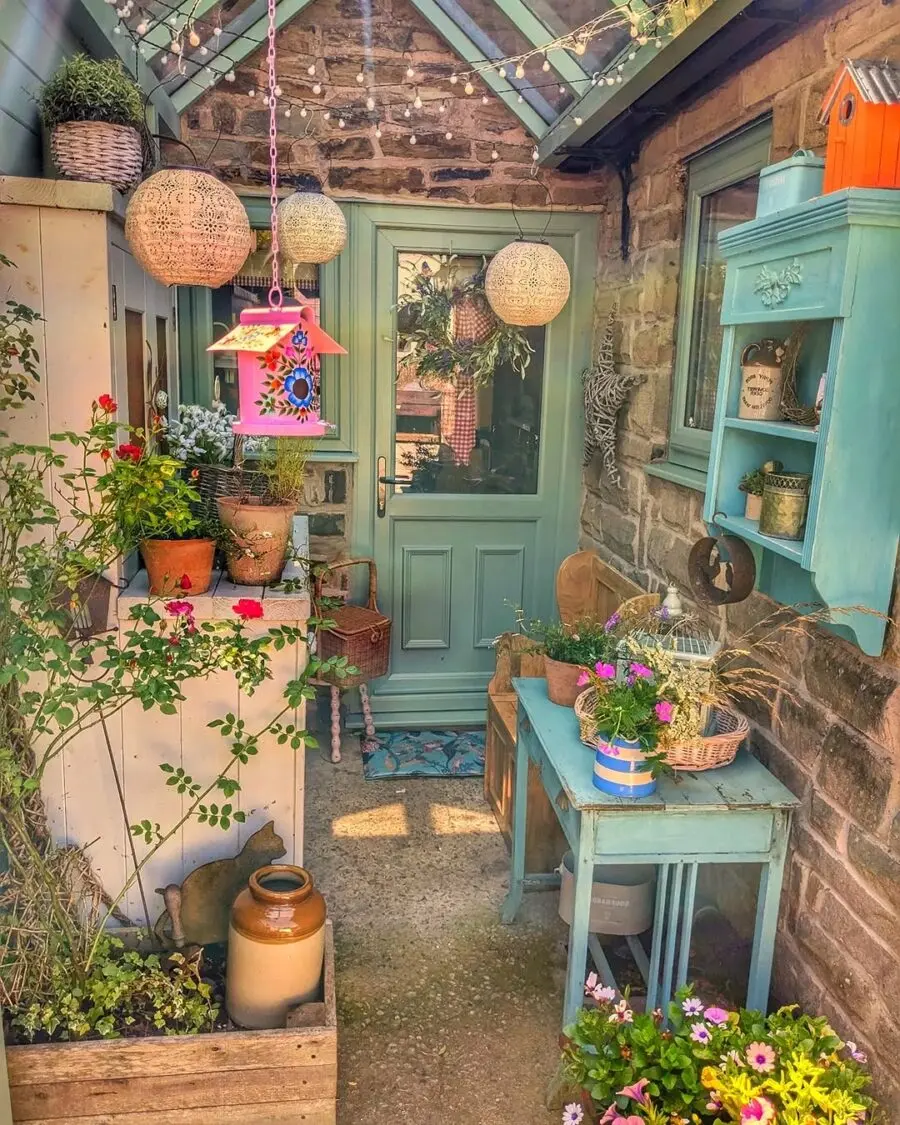 Charming porch decor with colorful plants.