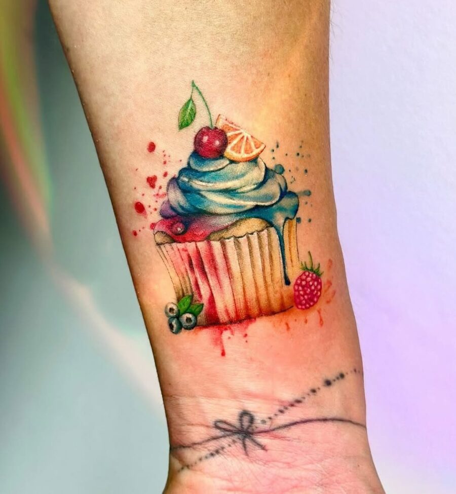 Lively cupcake tattoo with vibrant colors and details