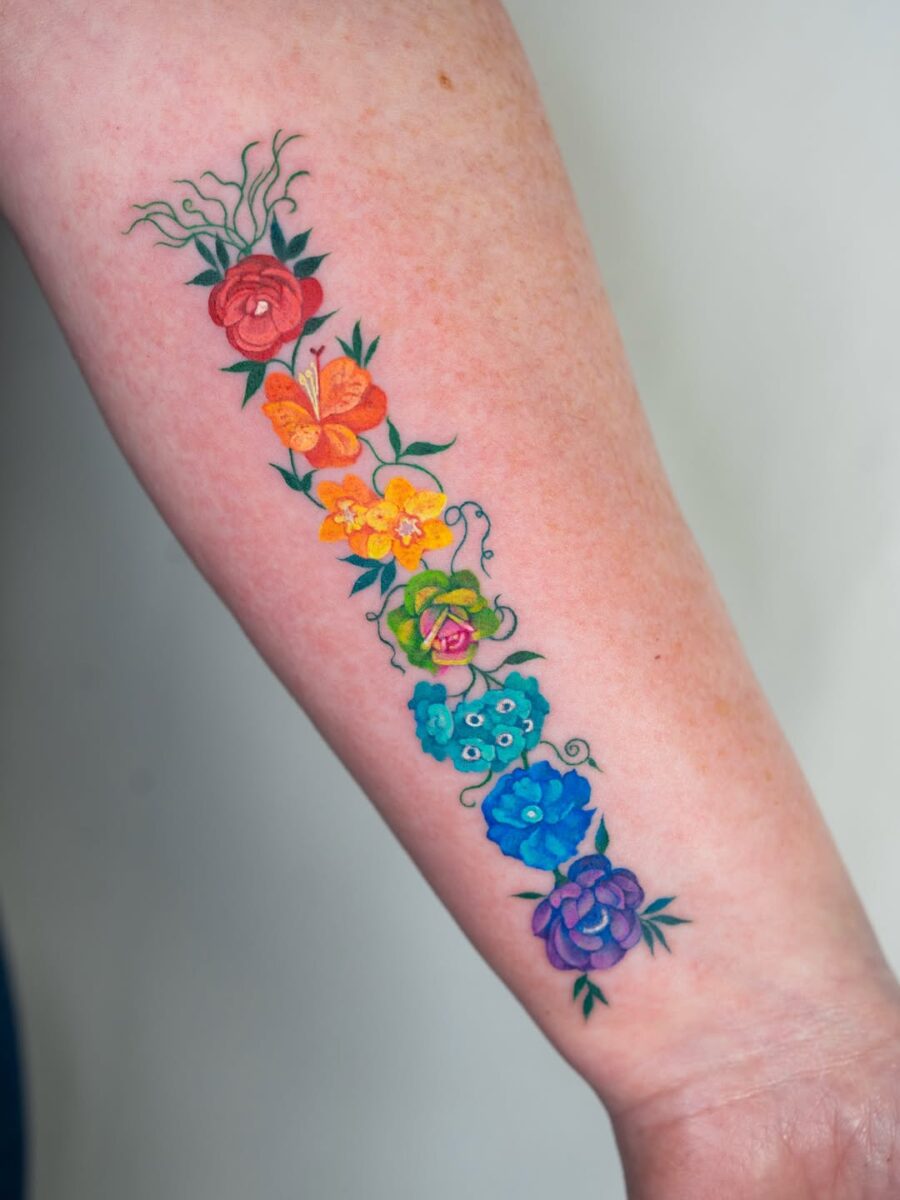 A vibrant floral tattoo bursting with color