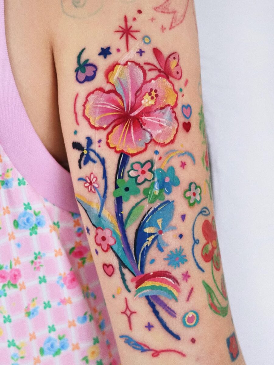 Colorful floral tattoos with a playful vibe