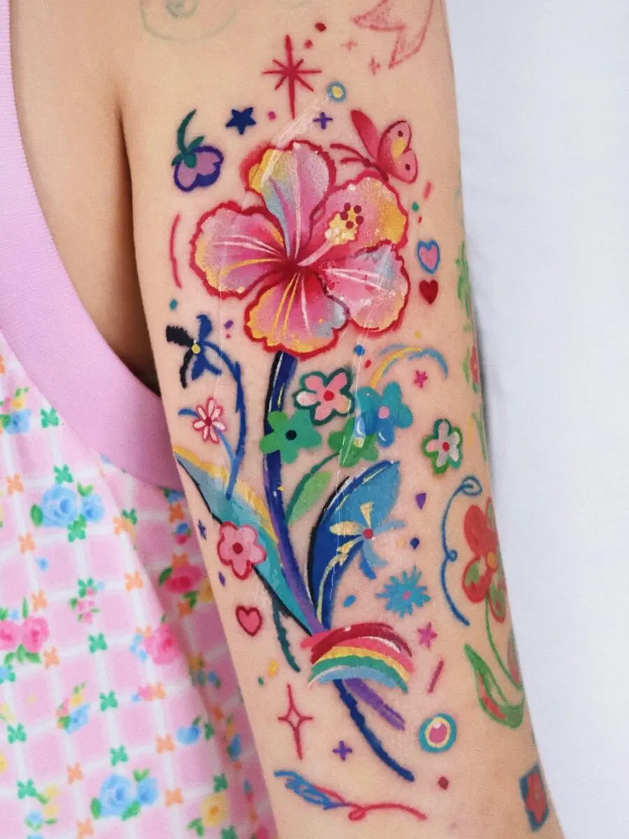 Colorful floral tattoos with a playful vibe