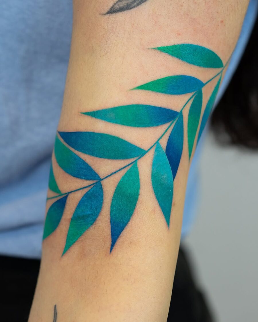 Stunning green and blue leaf tattoo design