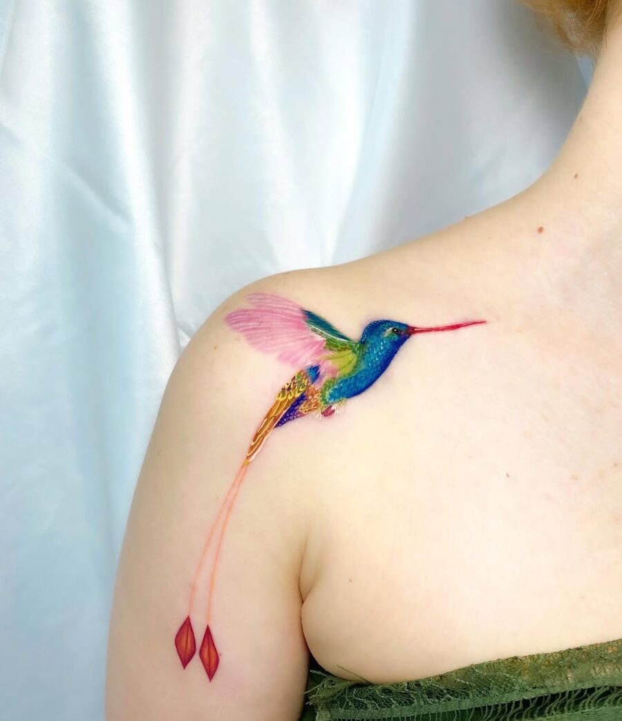 Colorful hummingbird tattoo with graceful details
