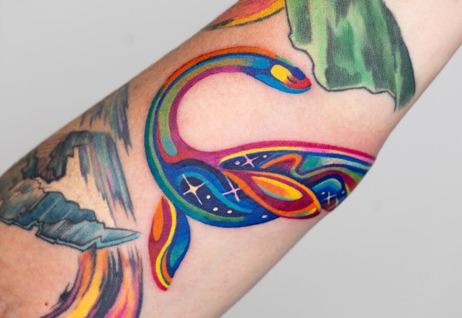 Colorful snake tattoo with artistic flair