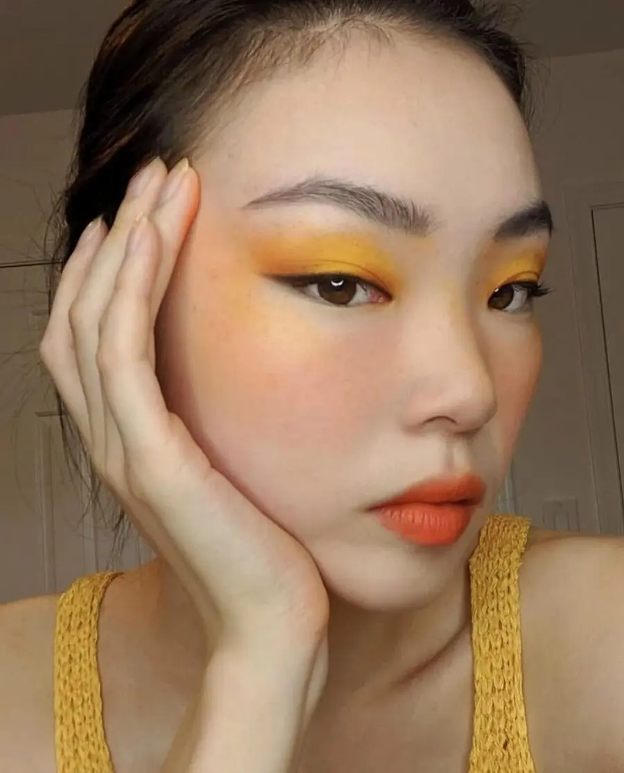 Bright yellow makeup for a bold look