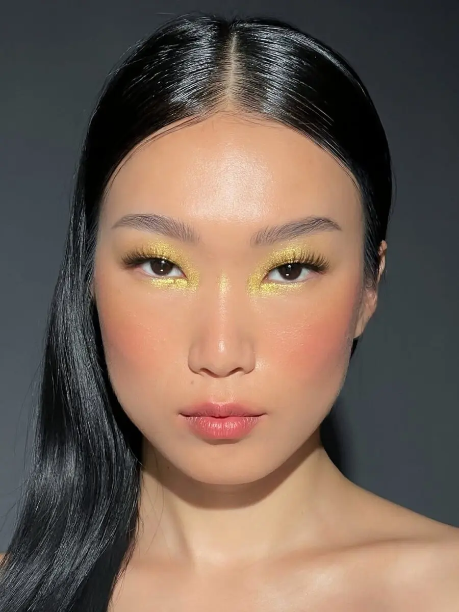 Bold yellow makeup look for stunning impact