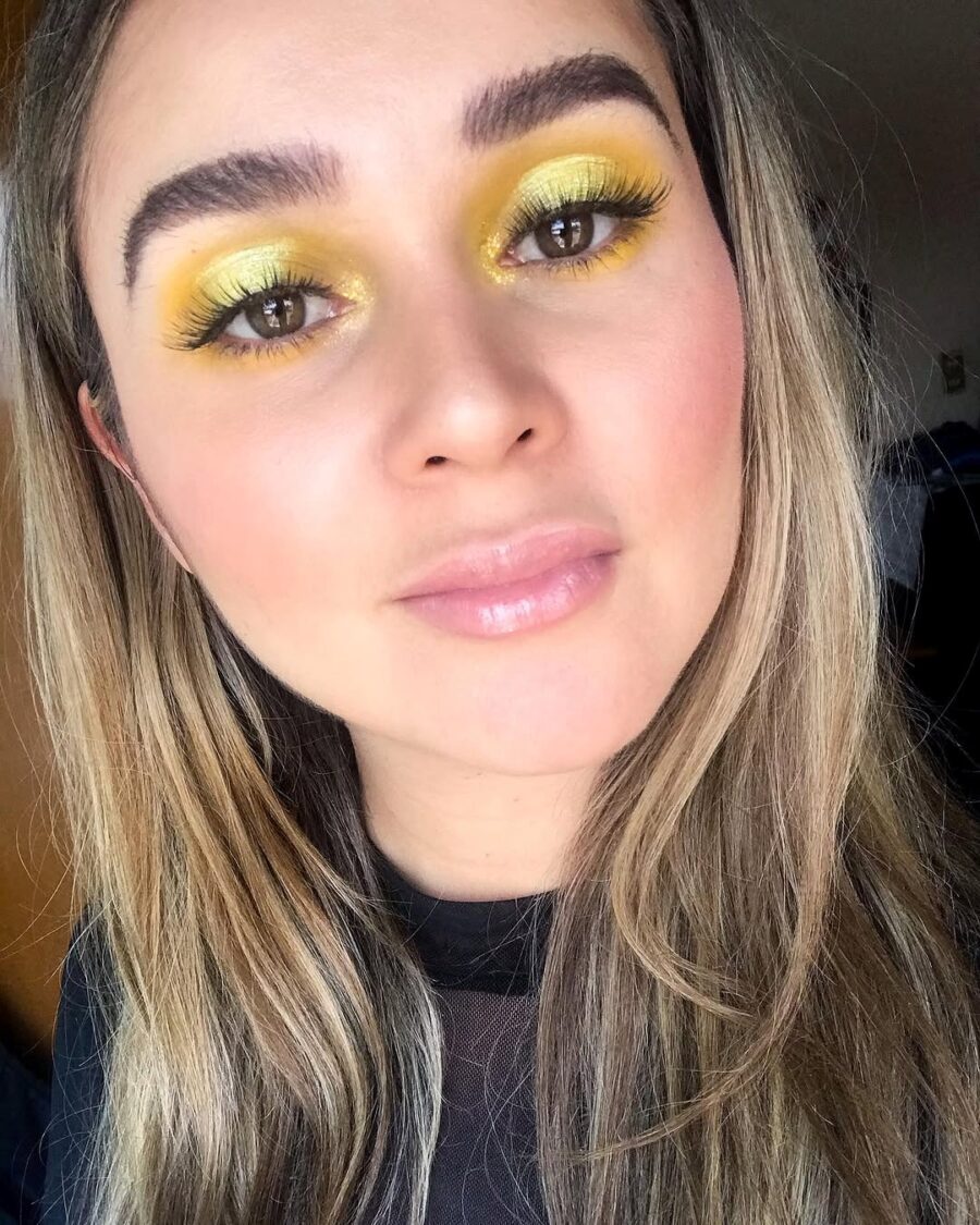 Bright yellow eye makeup for a sunny vibe
