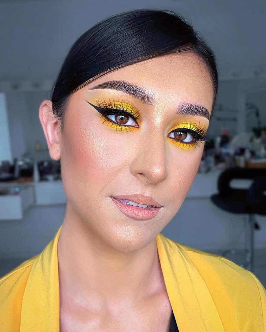 Bold yellow makeup for a striking look