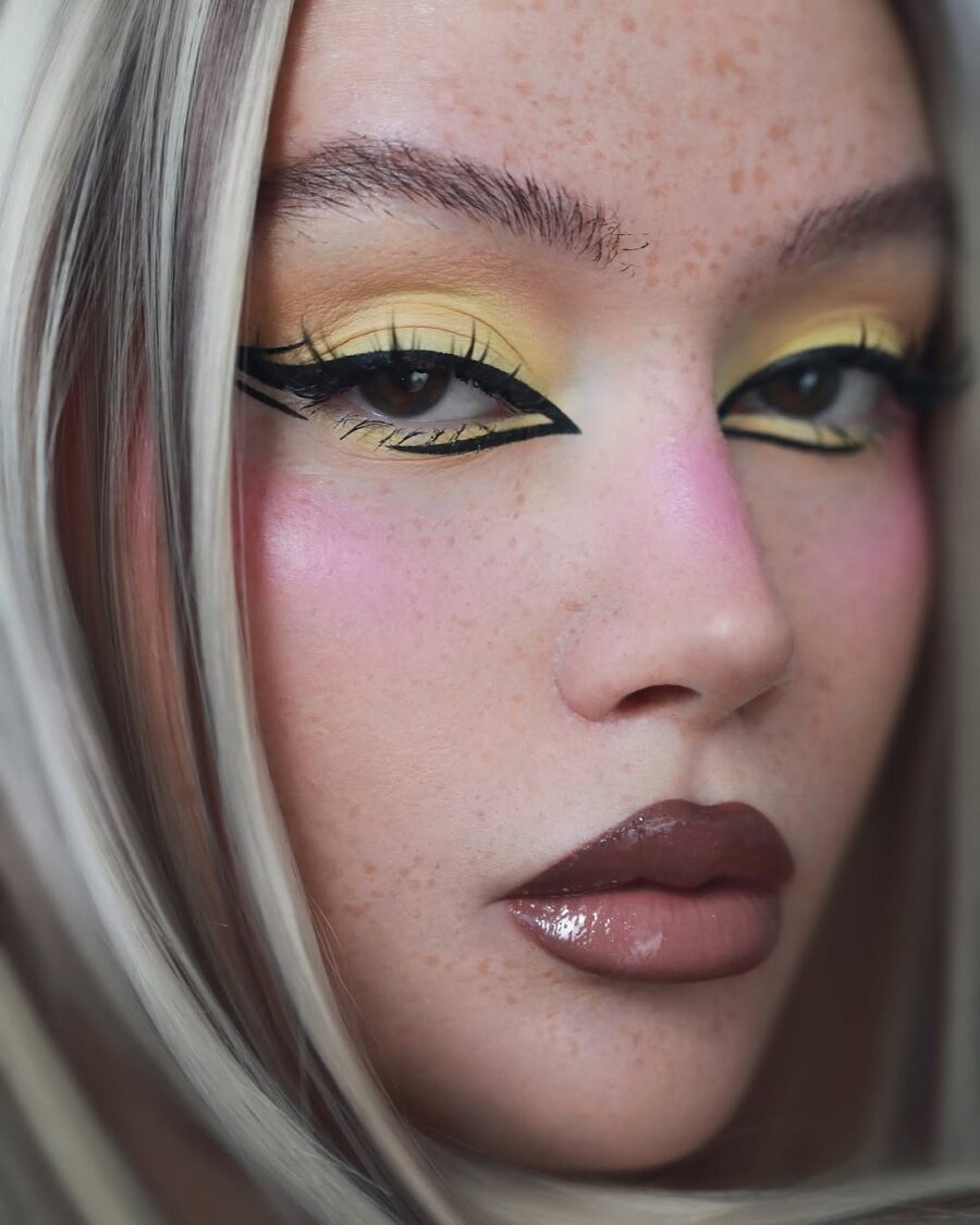 Bold yellow makeup with striking contrasts