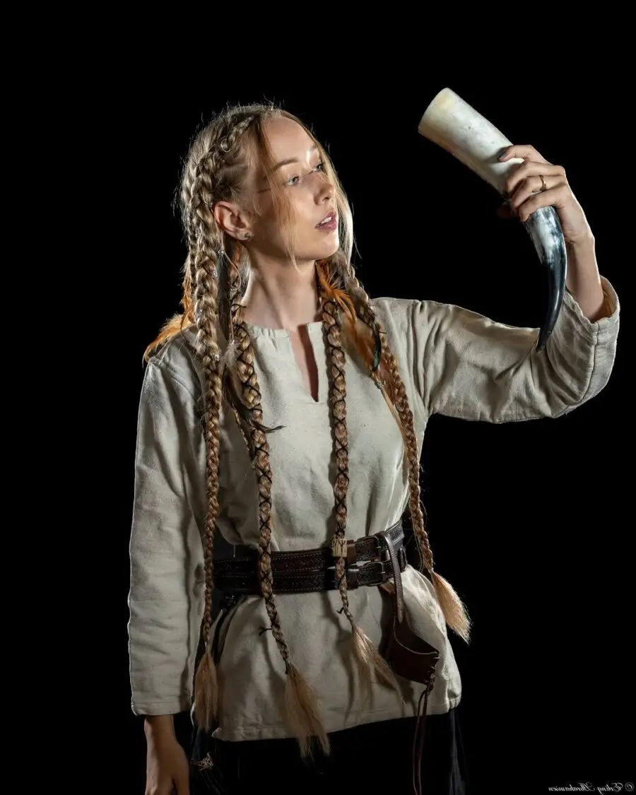 Viking woman showcasing intricate braided hairstyle