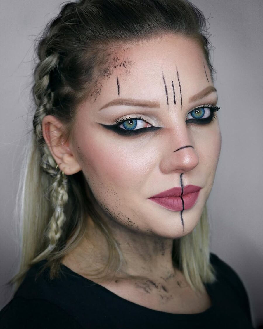 Dramatic Viking-inspired braided hairstyle with face art