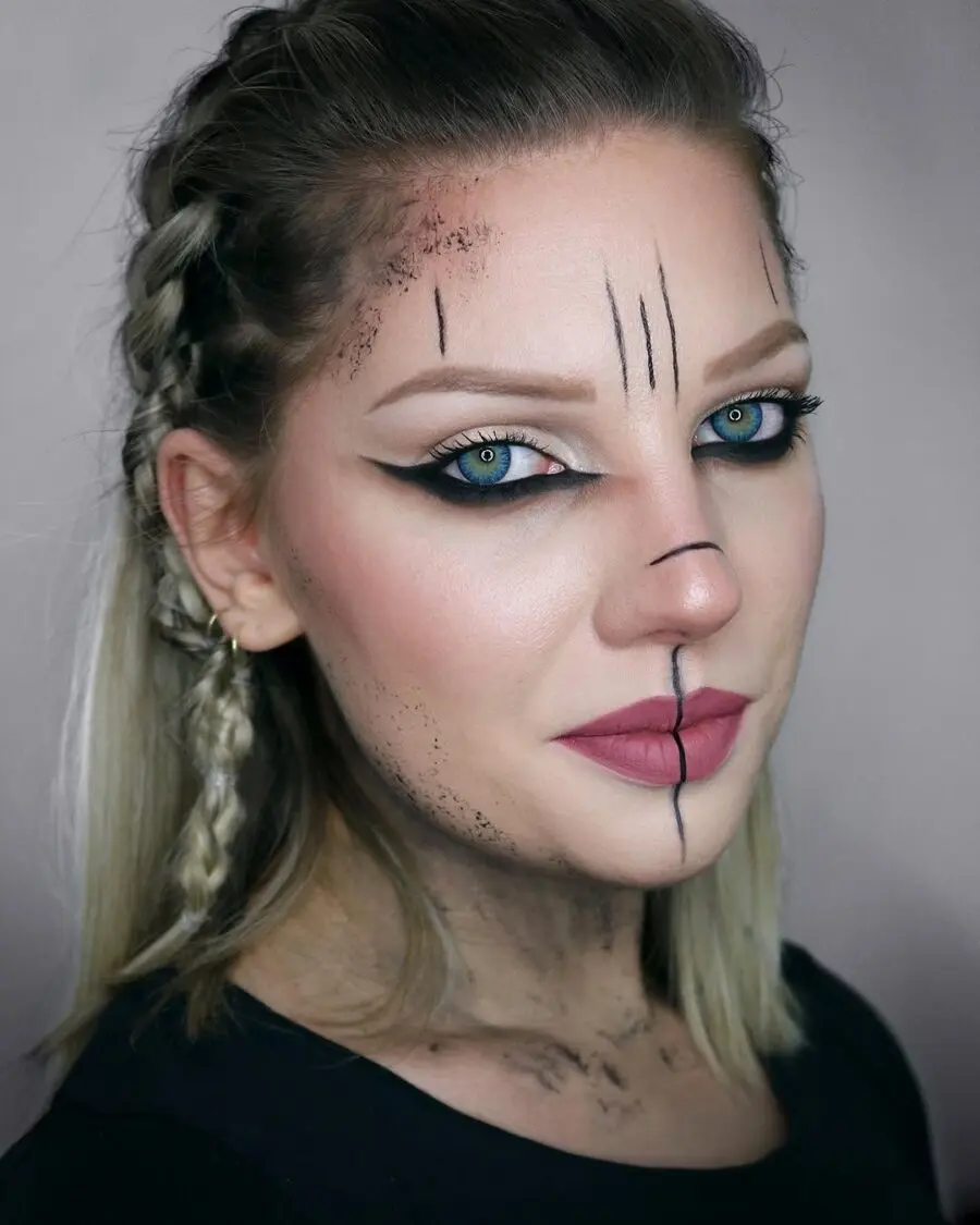 Dramatic Viking-inspired braided hairstyle with face art