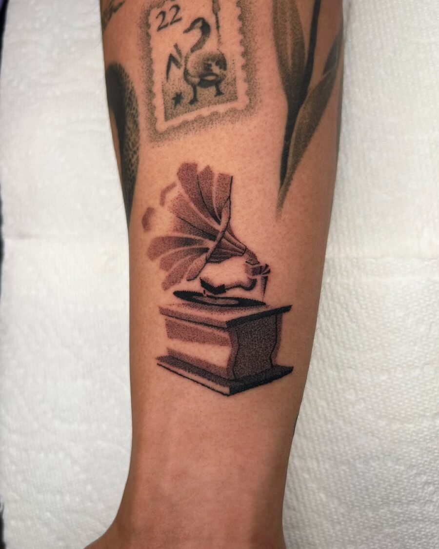 Classic tattoo featuring a vintage record player