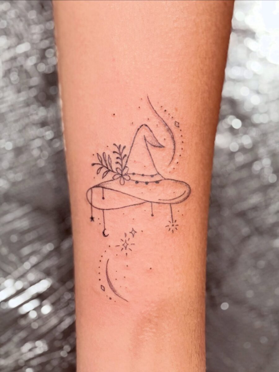 Whimsical witch hat adorned with nature and stars