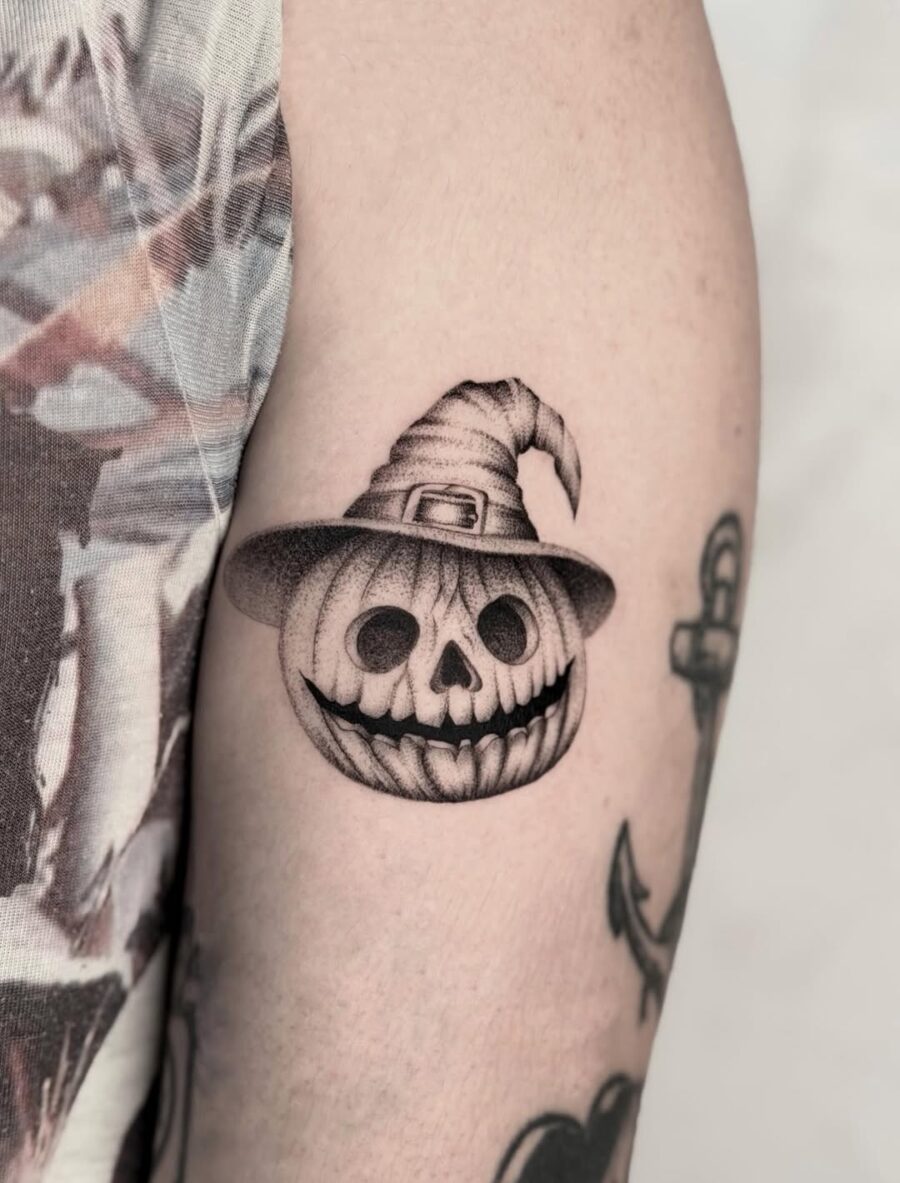 Spooky skull with witch hat design tattoo