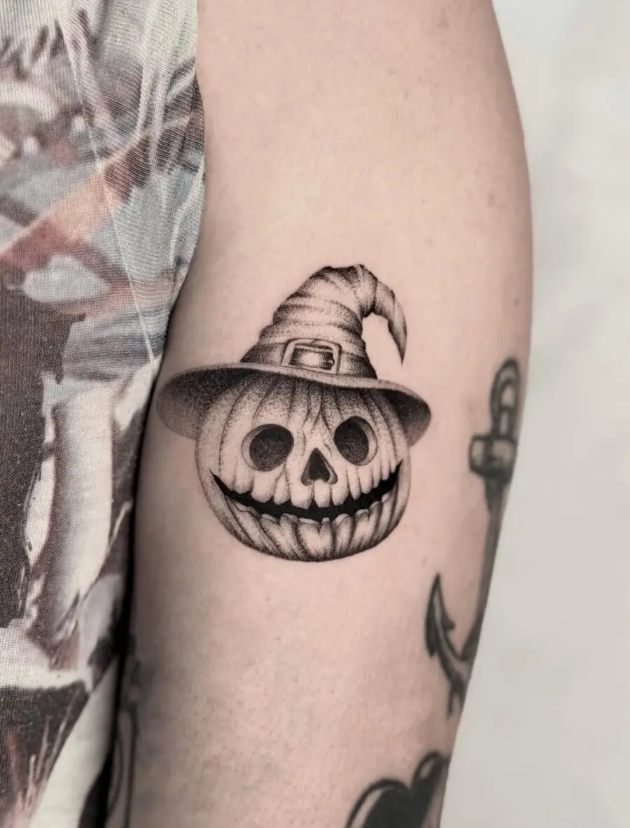 Spooky skull with witch hat design tattoo