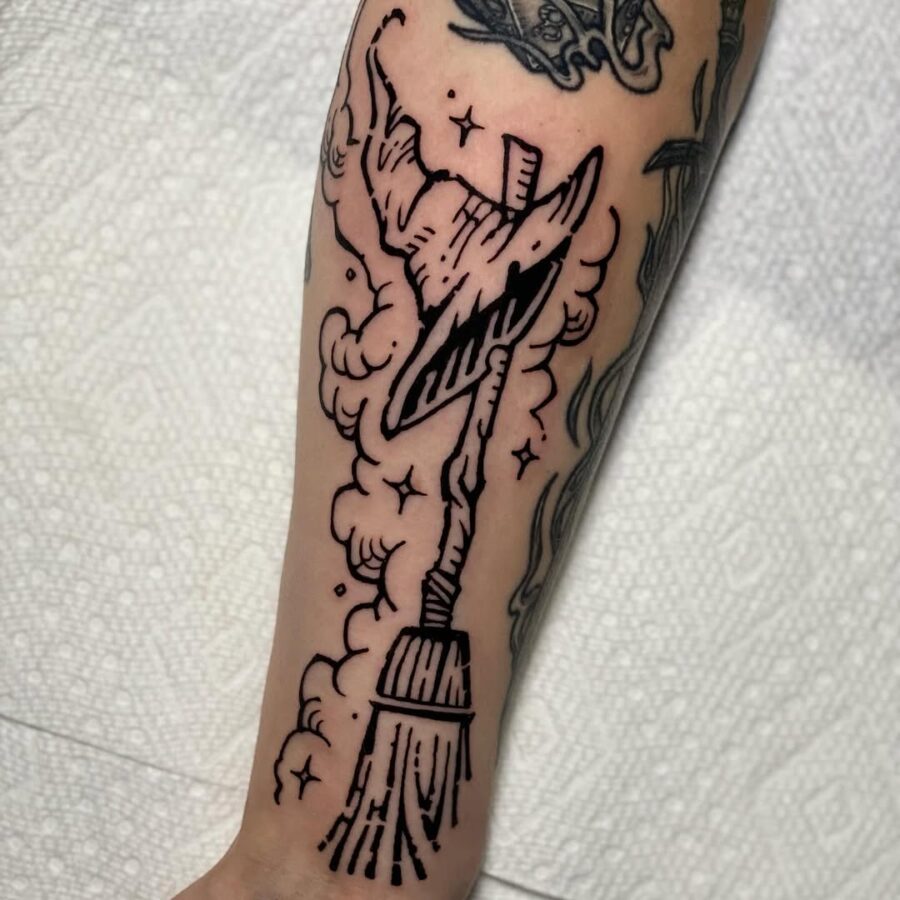 Magical witch hat with broomstick design