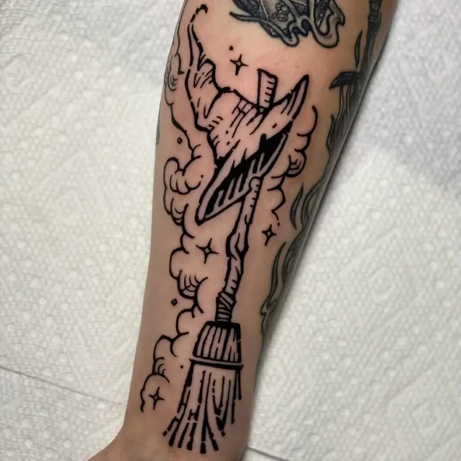Magical witch hat with broomstick design